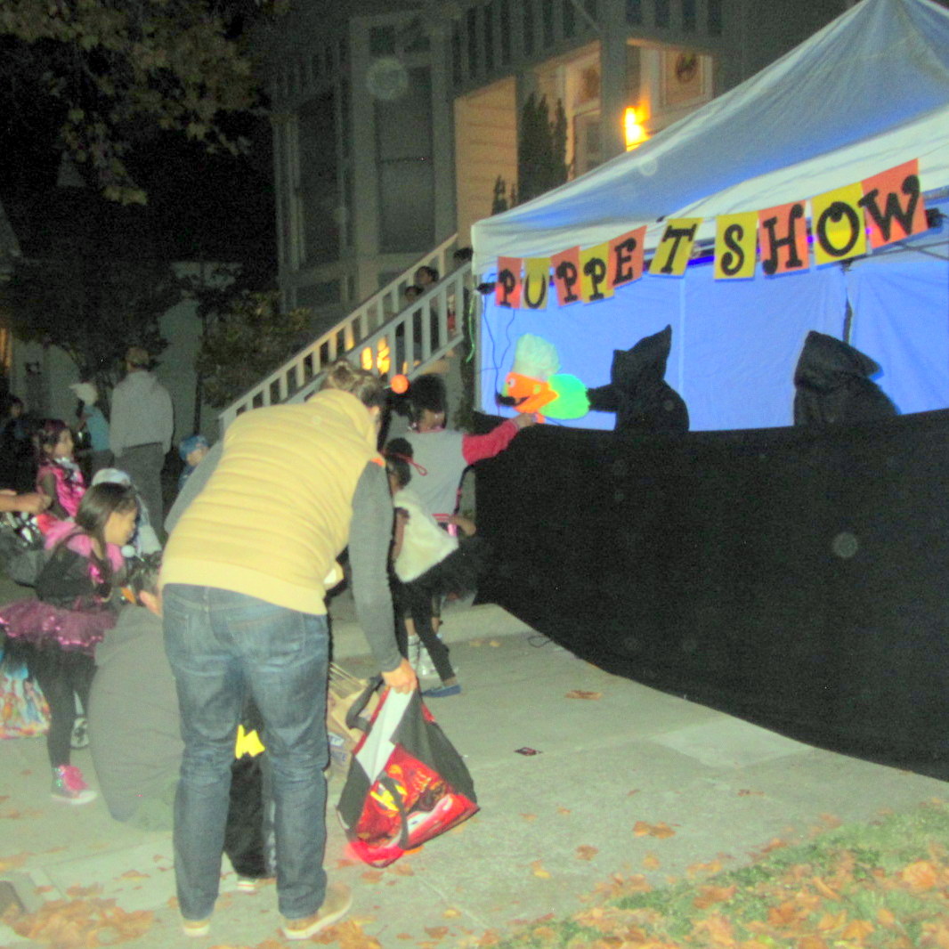 CHILDREN WATCH PUPPET SHOW AT ALAMEDA HALLOWEEN OUTREACH